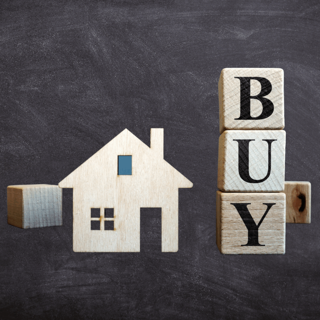 A wooden block with the word buy written on it.